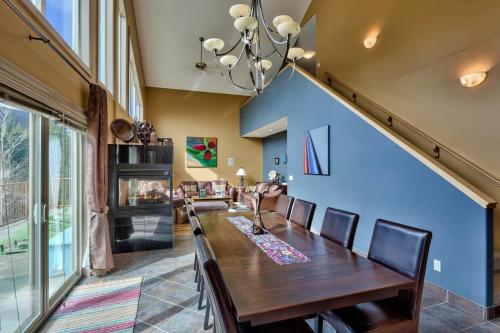 a dining room with a wooden table and chairs at Soleil Chalet By Bear Country in Sun Peaks