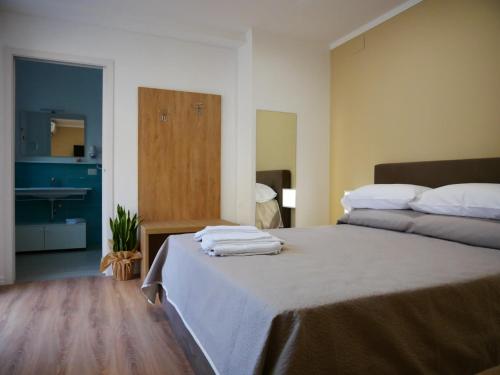 Postel nebo postele na pokoji v ubytování B&B Civico 66