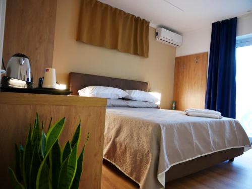 Postel nebo postele na pokoji v ubytování B&B Civico 66