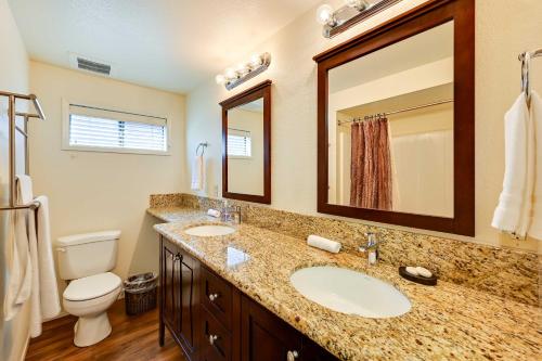 a bathroom with a sink and a toilet and a mirror at Ocean-View La Jolla Condo Rental with Covered Patio! in San Diego