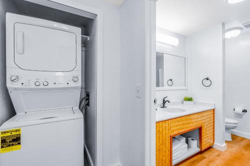 a bathroom with a sink and a fireplace at Kahala 924 in Koloa