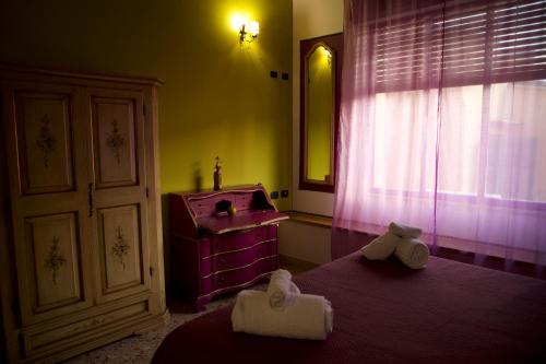 a bedroom with two beds and a sink and a window at Abali' Gran Sultanato in Palermo