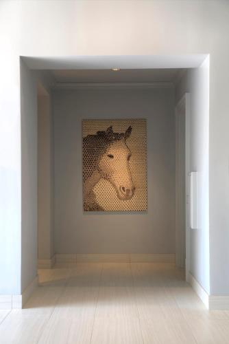 a painting of a horse on a wall in a room at Franklin Marriott Cool Springs in Franklin