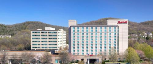 two tall buildings in front of a mountain at Franklin Marriott Cool Springs in Franklin