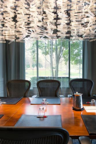 a conference room with a table and chairs at Franklin Marriott Cool Springs in Franklin