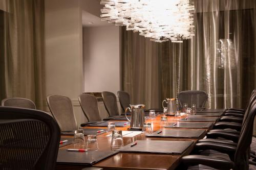 a long table in a room with chairs and a chandelier at Franklin Marriott Cool Springs in Franklin