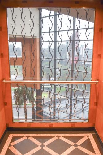a window with a view of a building at Sheraton Pilar Hotel & Convention Center in Pilar