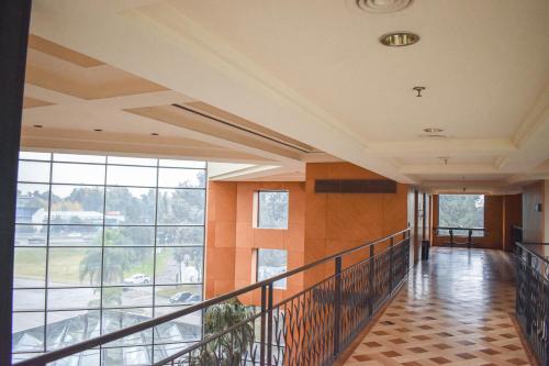 a hallway in a building with a large window at Sheraton Pilar Hotel & Convention Center in Pilar