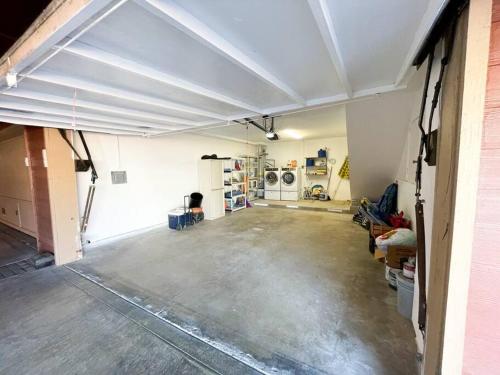 an empty garage with a concrete floor and appliances at IB Seaside Paradise w/ Ocean Views! in Imperial Beach