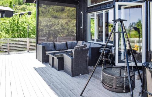 a screened in porch with a couch on a patio at Amazing Home In Treungen With Wifi in Treungen
