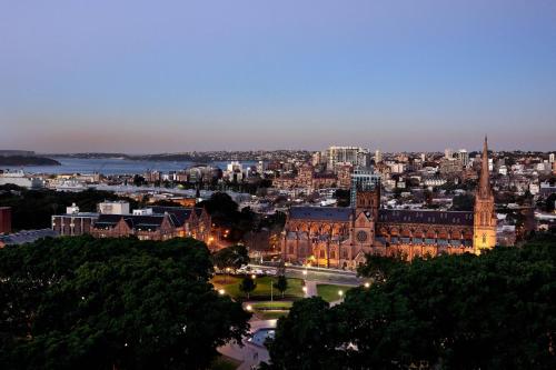 a view of the city of launceston at night at Sheraton Grand Sydney Hyde Park in Sydney