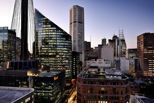 a view of a city skyline with tall buildings at Sheraton Grand Sydney Hyde Park in Sydney