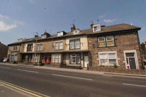 a brick building on the side of a street at Lundwood House Barnsley by Smart Corporate Stays in Barnsley