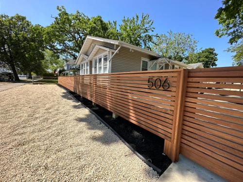 a fence in front of a house with at Spacious 3-Bedroom Bungalow in Bradley Beach in Bradley Beach