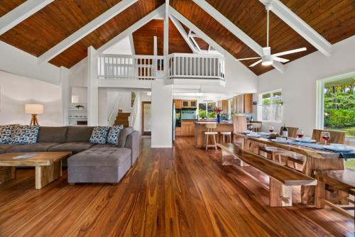 a living room with a couch and a table at 3982 Kalakaua 4br 3ba Home in Princeville in Princeville