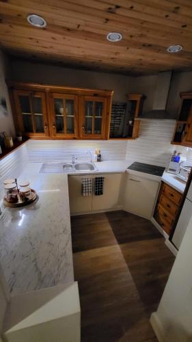 a kitchen with a sink and a counter top at Vimy House in Clifden