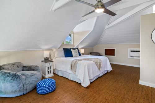 a bedroom with a bed and a ceiling fan at 3982 Kalakaua 4br 3ba Home in Princeville in Princeville