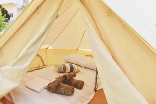 a white tent with a pair of shoes in it at Camping Tents with Garden Hanging Bed in Porto Rafti
