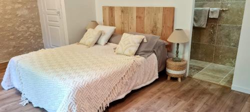a bedroom with a bed and a shower at La Bohème in Condom