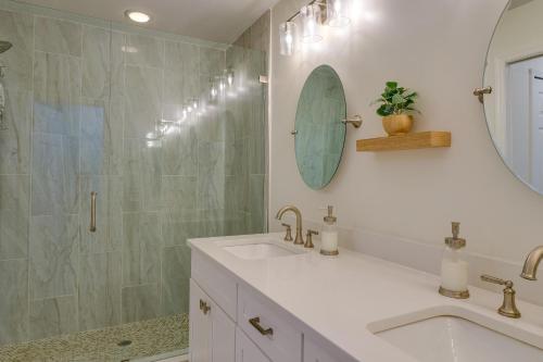 a bathroom with a sink and a mirror at Pet-Friendly Cape Coral Vacation Rental with Lanai! in Cape Coral