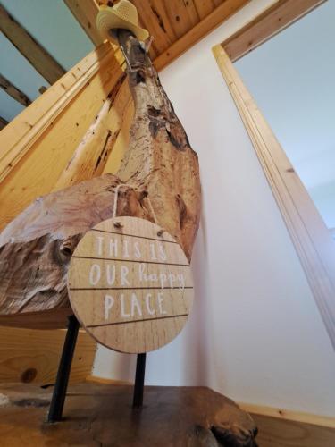 a sign that reads this is our happy place in a room at Erlebnisbauernhof Gutschi Ranch in Kamp