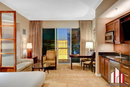 a hotel room with a kitchen and a living room at MGM Signature-33-705 F1 Track & Strip View Balcony in Las Vegas