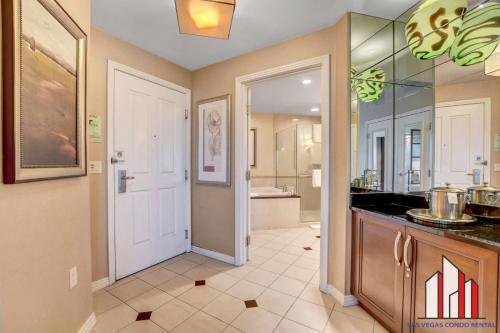 a large bathroom with a sink and a mirror at MGM Signature-33-805 F1 Track & Strip View Balcony in Las Vegas