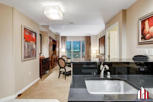a kitchen with a sink and a counter top at MGM Signature-34-821 1Br2Ba F1 Strip View Balcony in Las Vegas