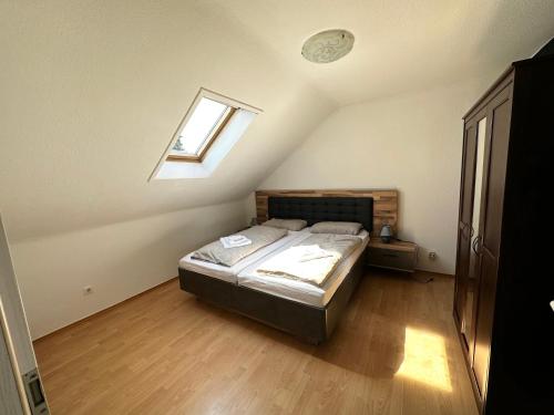 a bedroom with a bed in a room with a window at BocholtApartments in Bocholt