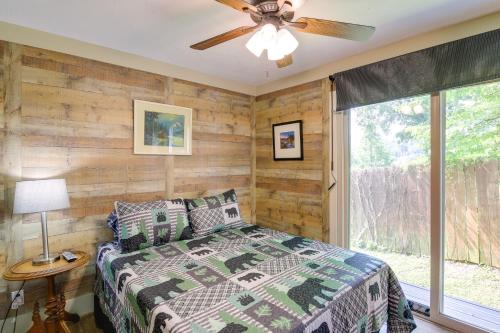 a bedroom with a bed and a ceiling fan at Gatlinburg Home Mountain Views and Indoor Hot Tub! in Gatlinburg