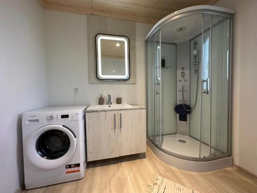 a bathroom with a washing machine and a shower at Villa Twins 16 - Pakoštane in Pakoštane