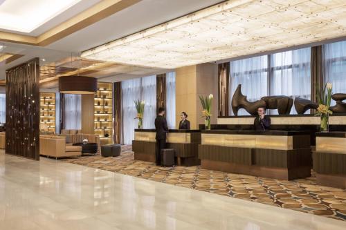 a rendering of the lobby of a hotel at Courtyard by Marriott Suzhou in Suzhou