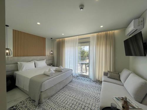 Ένα ή περισσότερα κρεβάτια σε δωμάτιο στο URBAN SUITES ATHENS