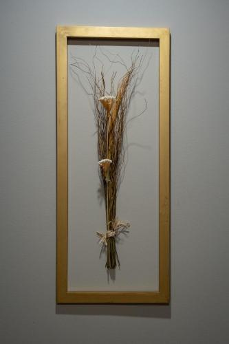 a picture of a vase with branches in a frame at Bed&Breakfast Novalis in Novalja
