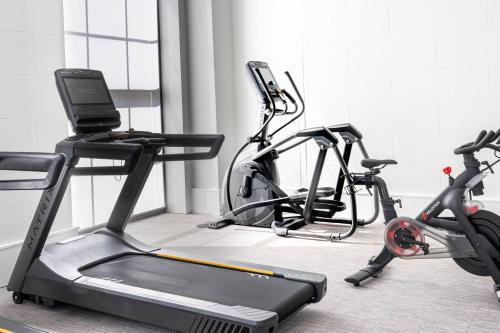 a gym with two exercise bikes and a treadmill at SpringHill Suites by Marriott Baltimore Downtown Convention Center Area in Baltimore