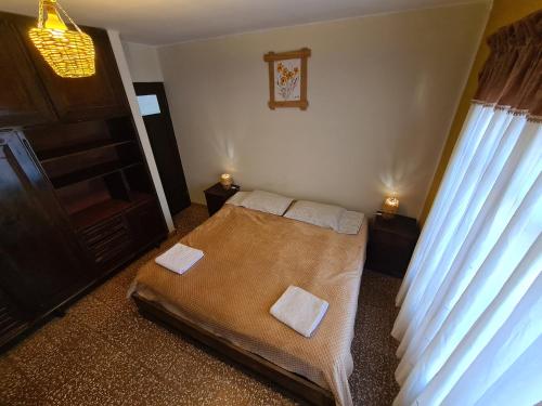Cama o camas de una habitación en La Cúpula Hostel & Camping