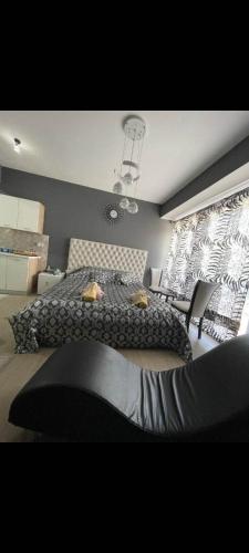 a bedroom with two beds and a window at Apartmani 2 SS in Ohrid