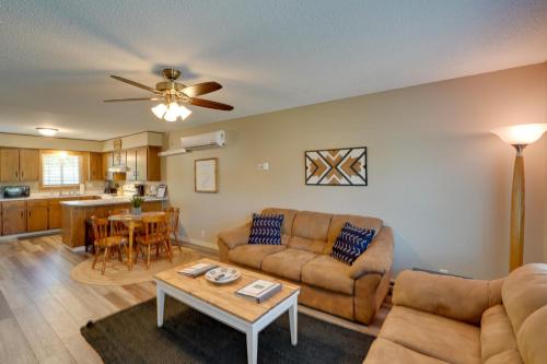 a living room with a couch and a table at Sacajawea Suite 1 with Deck in Heart of Medora! in Medora