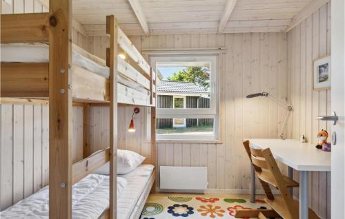 a tiny house with a desk and bunk beds at Gorgeous Home In Hals With Sauna in Hals