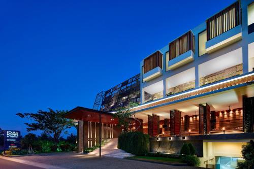 a building with a lit up facade at night at Four Points by Sheraton Bali, Seminyak in Seminyak