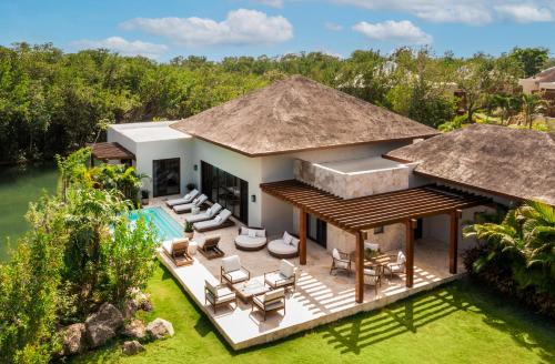 an aerial view of a villa with a swimming pool at Fairmont Mayakoba in Playa del Carmen