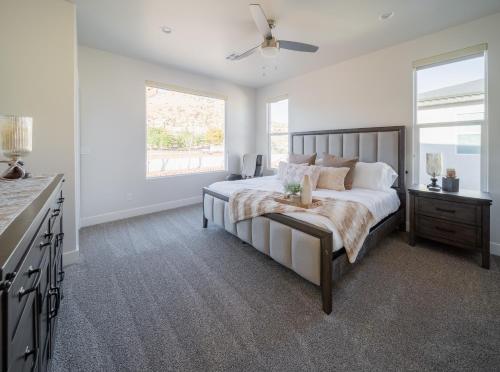 a bedroom with a large bed and a window at So Zion Painted Desert-4Bed, 3Bath, Hot Tub, Deck in Hildale
