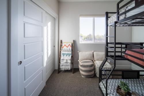 a room with a closet with a door and a chair at So Zion Painted Desert-4Bed, 3Bath, Hot Tub, Deck in Hildale