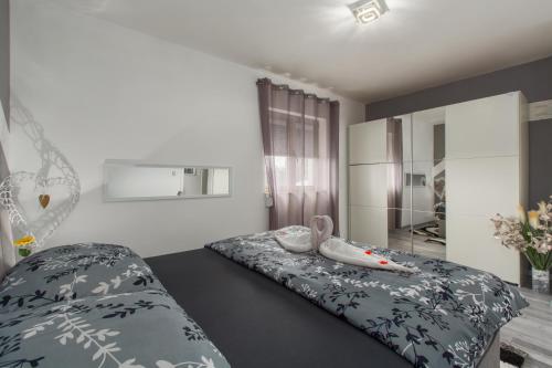 Apartment 50 shades of grey Poreč tesisinde bir odada yatak veya yataklar
