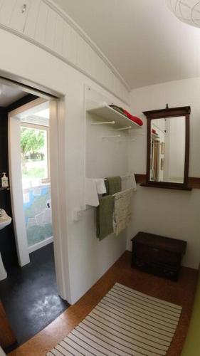 a room with a bathroom with a mirror and towels at Innisfreedom cabin in Sligo