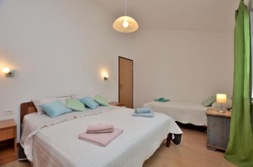 Postel nebo postele na pokoji v ubytování House MARLU