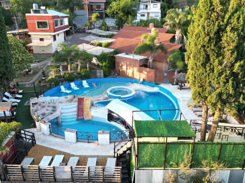 an overhead view of a swimming pool with a resort at Complejo Los Cipreses in Villa Carlos Paz