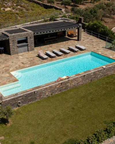 an overhead view of a swimming pool in a backyard at Bella Resorts Andros in Andros