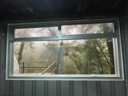 a window in a room with a view at MANDALA CAMP in Tomatlán