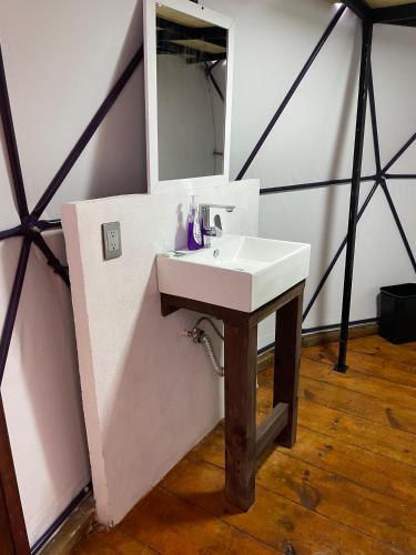 a bathroom with a sink and a mirror at MANDALA CAMP in Tomatlán